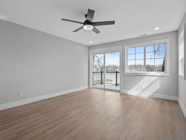 unfurnished room with baseboards, visible vents, a ceiling fan, wood finished floors, and recessed lighting