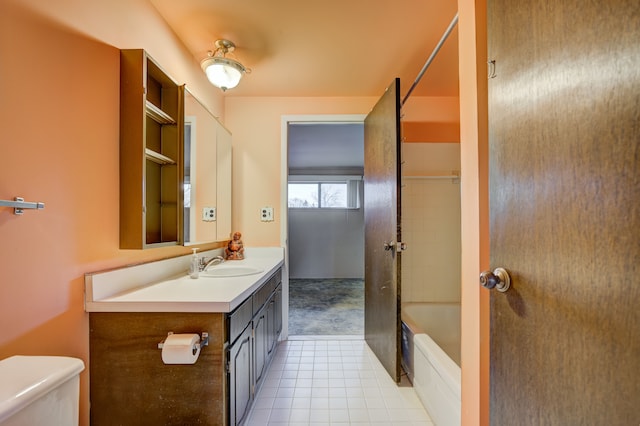 full bathroom featuring vanity, tile patterned floors, and toilet