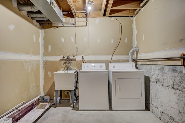 laundry room featuring independent washer and dryer and laundry area