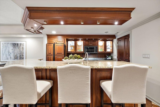 bar featuring ornamental molding, indoor wet bar, and recessed lighting