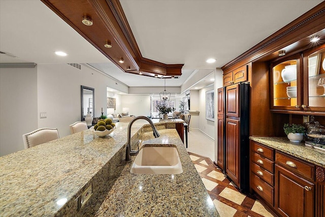 kitchen with recessed lighting, a sink, visible vents, and crown molding