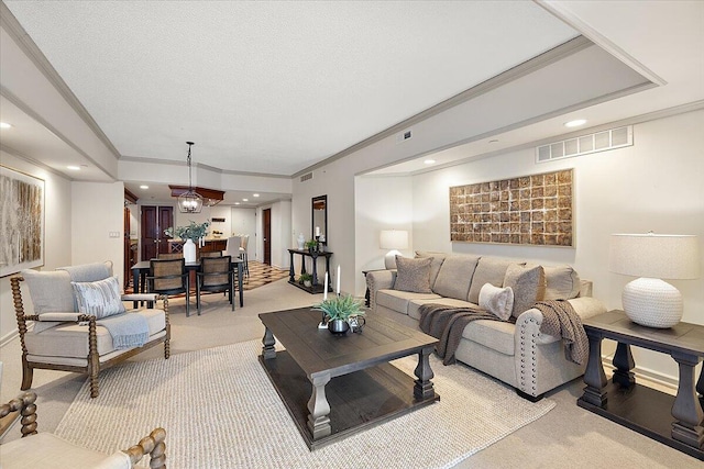 living room featuring recessed lighting, visible vents, light colored carpet, and ornamental molding