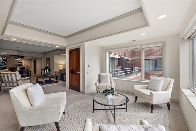 living room featuring light carpet, visible vents, baseboards, and recessed lighting