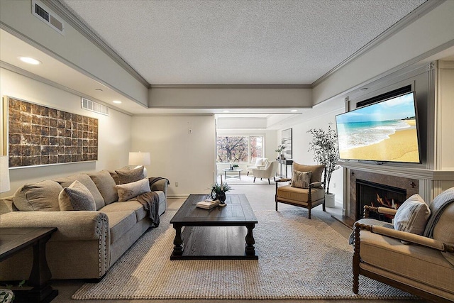 living room with a textured ceiling, visible vents, crown molding, and a high end fireplace