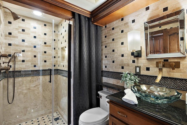 full bath with toilet, a shower stall, decorative backsplash, and vanity