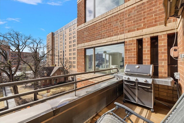 view of patio featuring a balcony and area for grilling