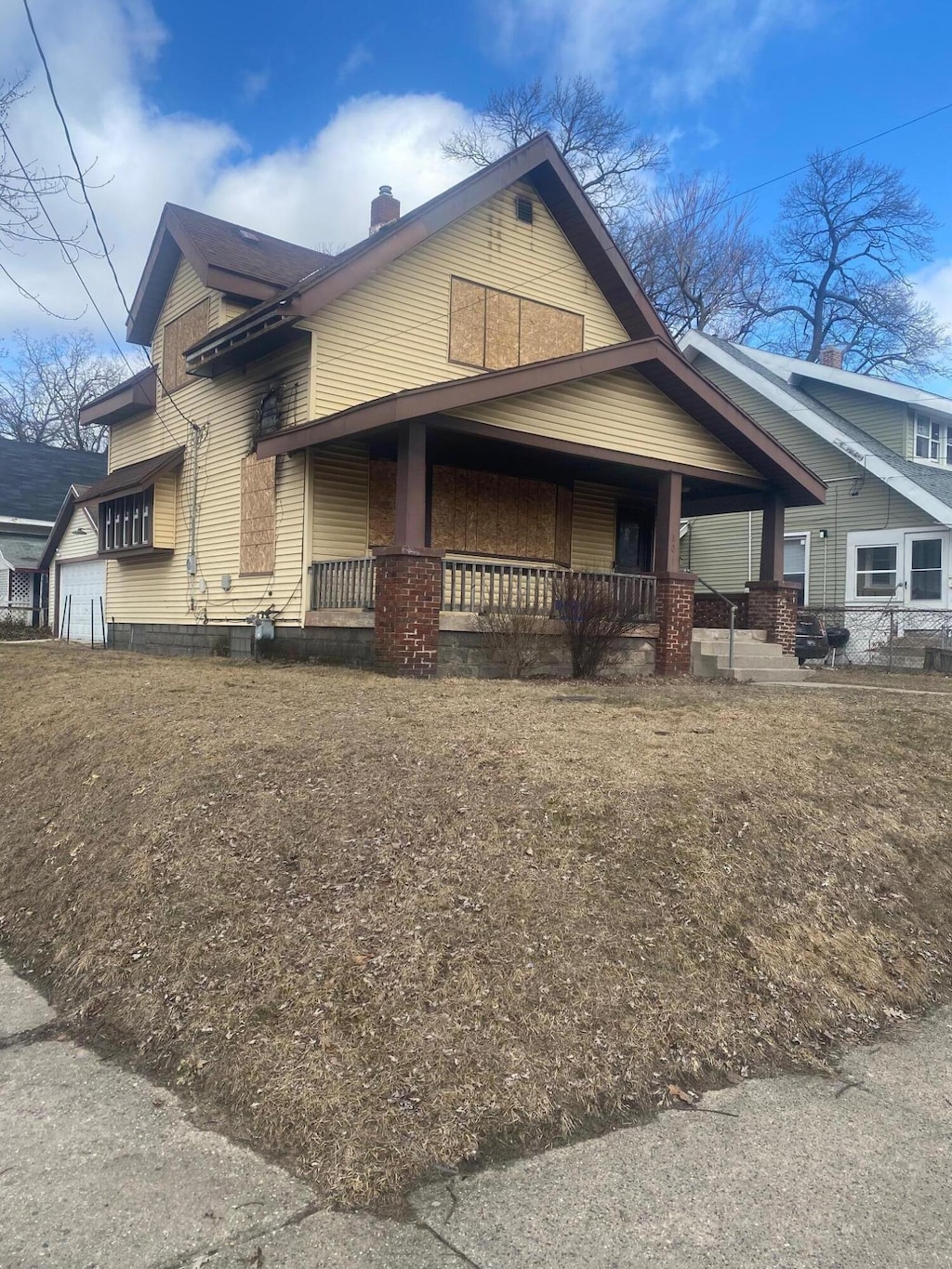 view of front of house with a porch and a chimney