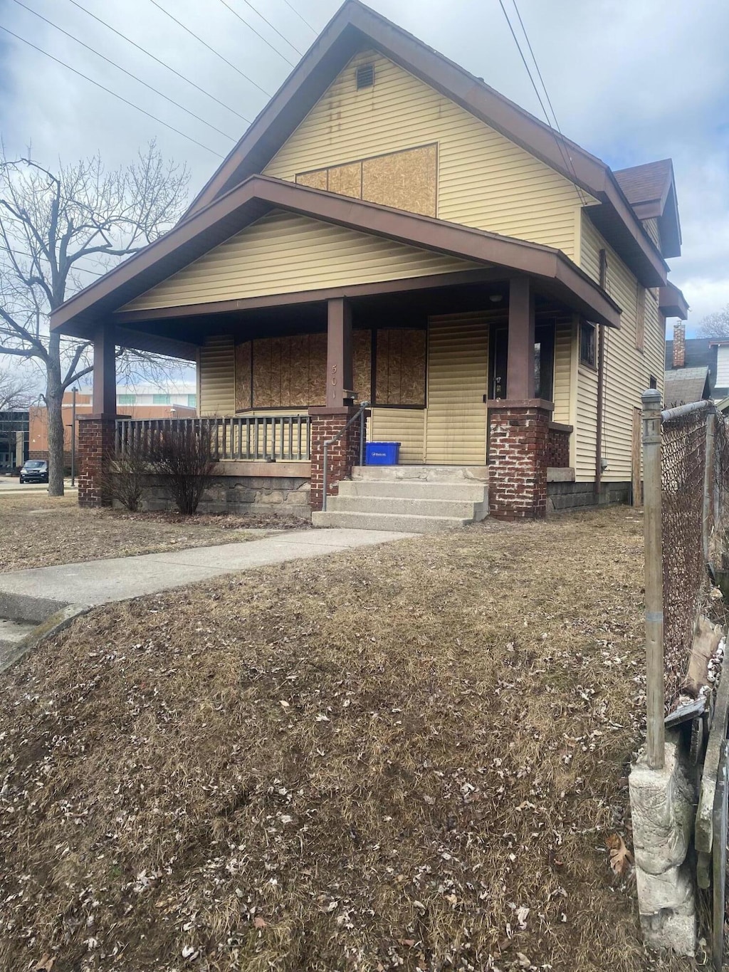 view of side of property featuring a porch