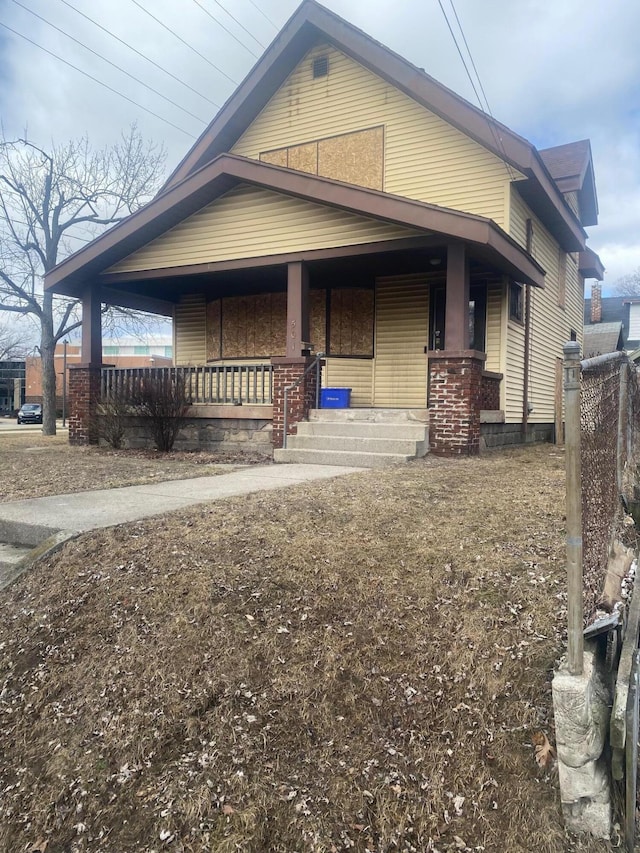 view of side of property featuring a porch