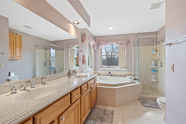 full bathroom with a stall shower, visible vents, toilet, tile patterned floors, and a sink