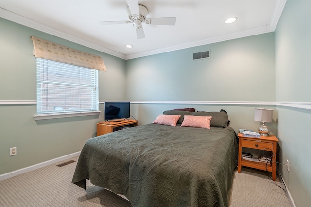 carpeted bedroom featuring visible vents, crown molding, and baseboards