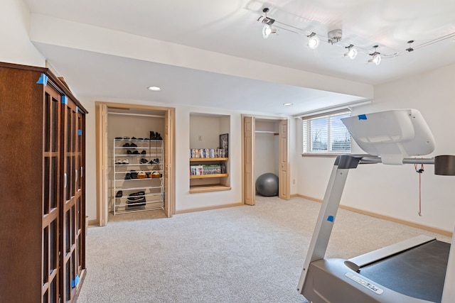 exercise area featuring recessed lighting, carpet, and baseboards