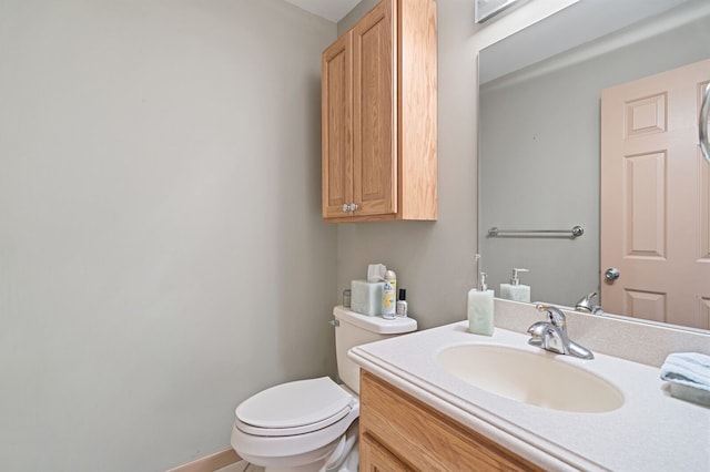 half bath with vanity and toilet