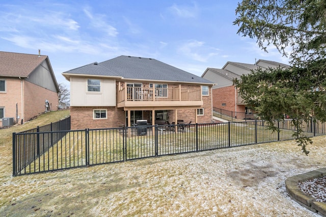 rear view of property with brick siding, a patio area, a fenced backyard, and central air condition unit