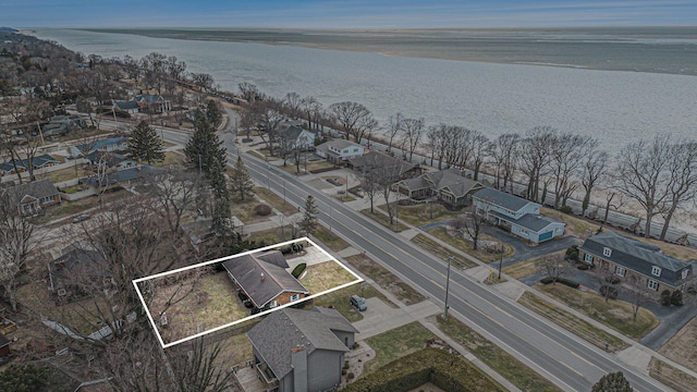 bird's eye view featuring a water view and a residential view