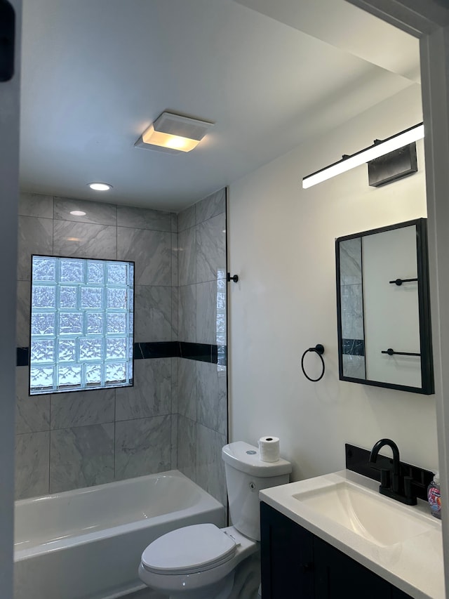 full bath with shower / bath combination, vanity, and toilet