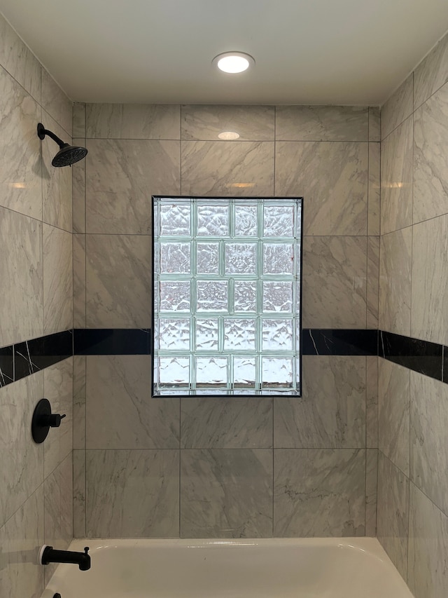 full bath featuring bathing tub / shower combination