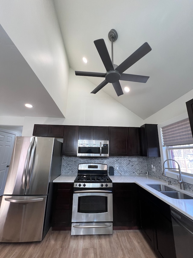 kitchen with a ceiling fan, light countertops, a sink, and appliances with stainless steel finishes