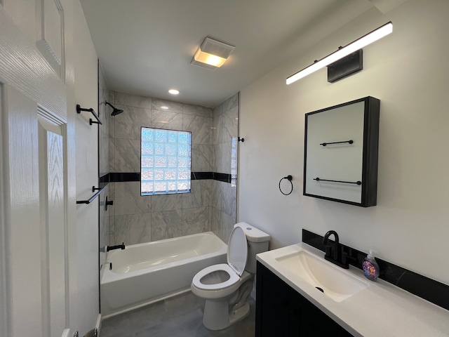 bathroom featuring toilet, vanity, and bathing tub / shower combination