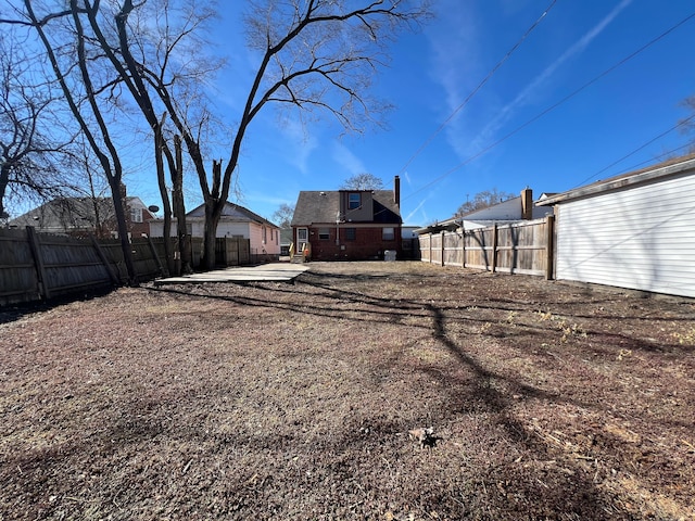 view of yard with a fenced backyard and a patio area