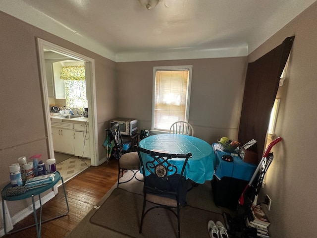 dining space with light wood-type flooring