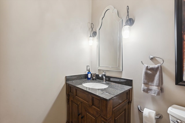 half bath with vanity and toilet