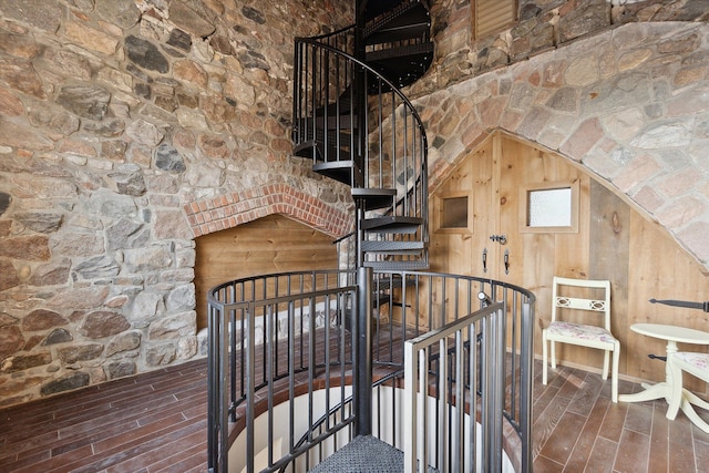 staircase featuring wood finished floors