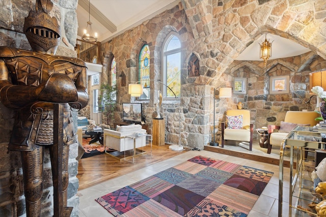 interior space featuring tile patterned flooring, crown molding, and a notable chandelier