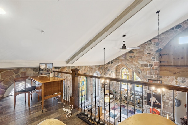 interior space with vaulted ceiling with beams and wood finished floors