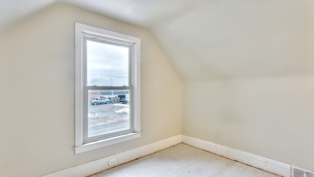 bonus room featuring vaulted ceiling