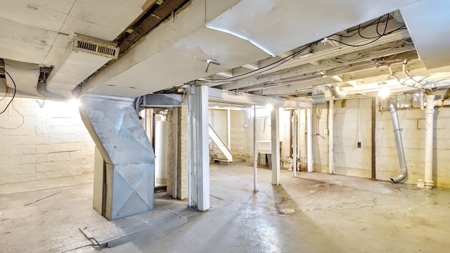 unfinished basement featuring visible vents