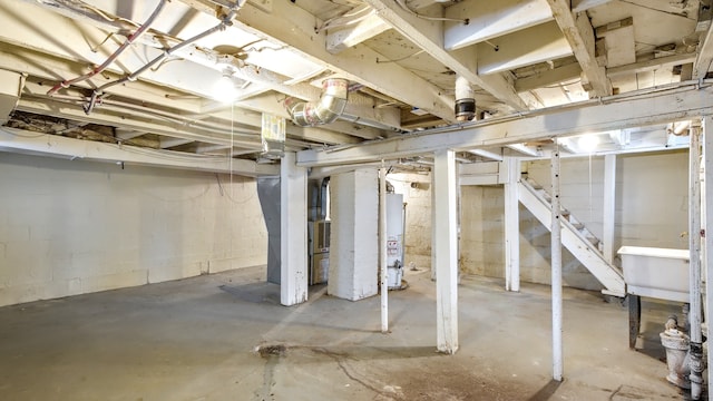 unfinished basement with water heater