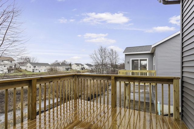 wooden terrace featuring a residential view