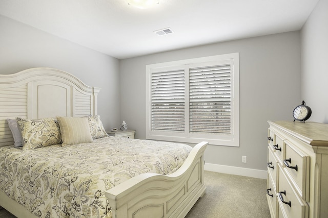 bedroom featuring light colored carpet, visible vents, and baseboards