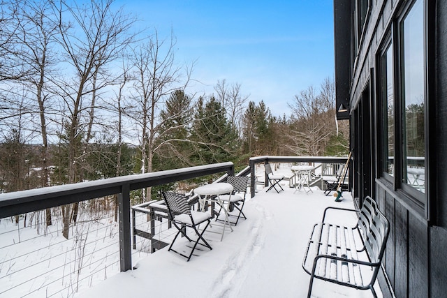 view of snow covered deck