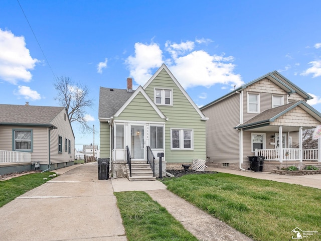 bungalow-style house with a porch, a front yard, roof with shingles, and a chimney