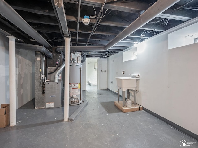 unfinished basement featuring baseboards, water heater, and heating unit