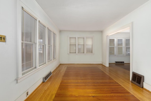 unfurnished sunroom with visible vents