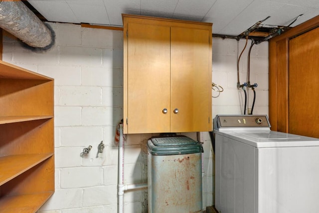 laundry area featuring washer / clothes dryer and cabinet space