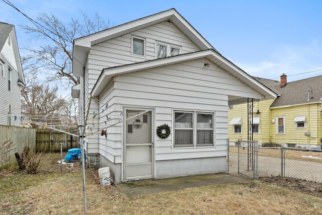 view of front of house with a gate and fence