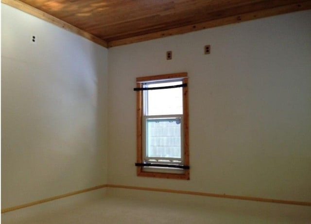 unfurnished room featuring wood ceiling