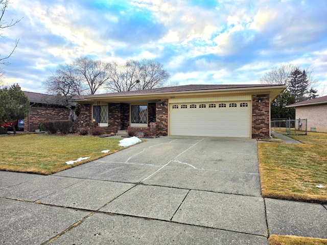 ranch-style house with driveway, a garage, fence, a front yard, and brick siding