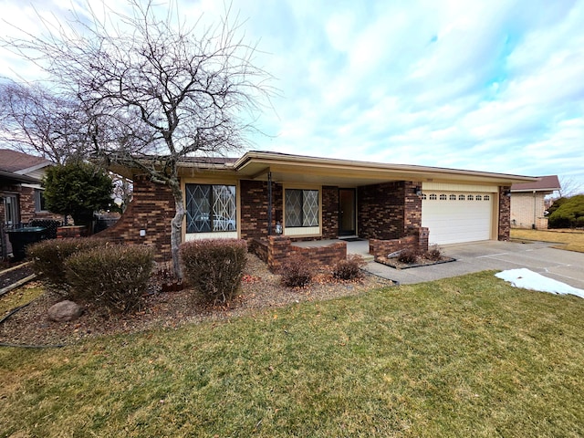 single story home with a garage, concrete driveway, brick siding, and a front yard