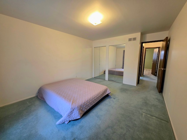 bedroom featuring carpet floors, baseboards, visible vents, and two closets