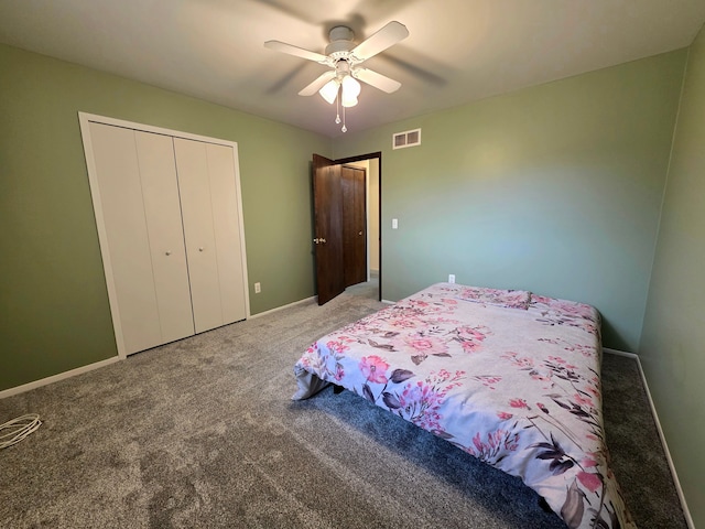 carpeted bedroom featuring ceiling fan, a closet, visible vents, and baseboards