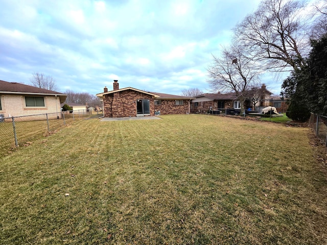 view of yard featuring a fenced backyard