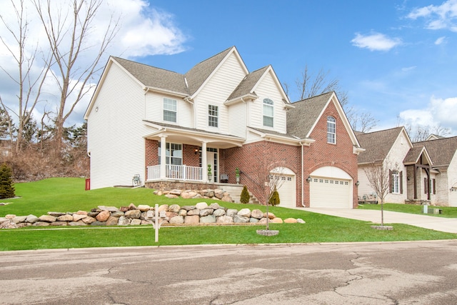 view of front of property with brick siding, a porch, concrete driveway, an attached garage, and a front yard