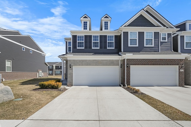 view of front facade featuring an attached garage and concrete driveway