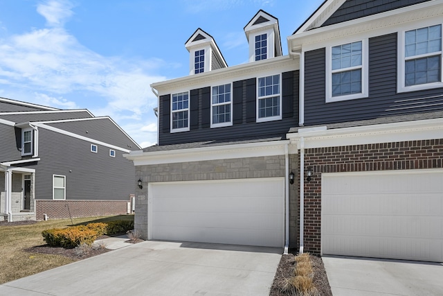 view of front of home featuring a garage and driveway