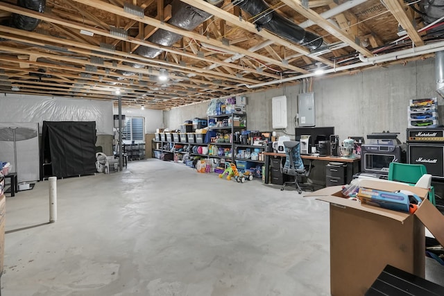 unfinished basement featuring electric panel